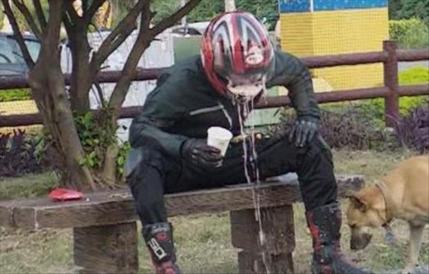 man-throwing-up-in-his-helmet-having-a-bad-day.jpg