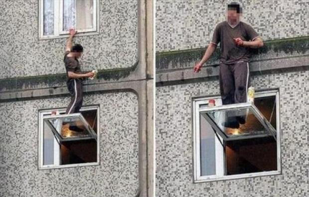 man-standing-on-a-ledge-funny-pictures.jpg