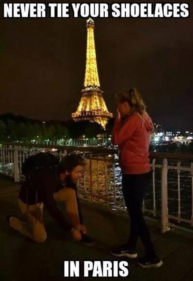 a guy ties his shoes in paris